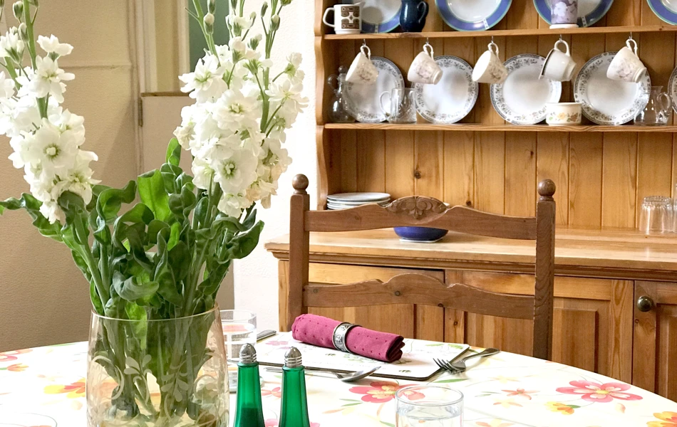 Fresh flowers and place settings in the Treveor House dining room