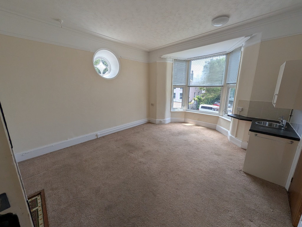 The bright private room with bay windows and a kitchenette that is currently available